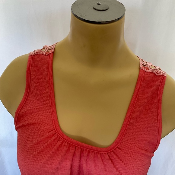 Filly Flair sleeve top. It has a very delicate detailed back in a coral color. - Picture 2 of 8